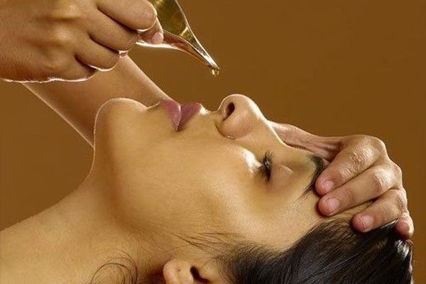 Nasya therapy - oil drops through the nostrils as part of Ayurvedic Panchakarma therapies for eyes to support vision and reduce eye strain.